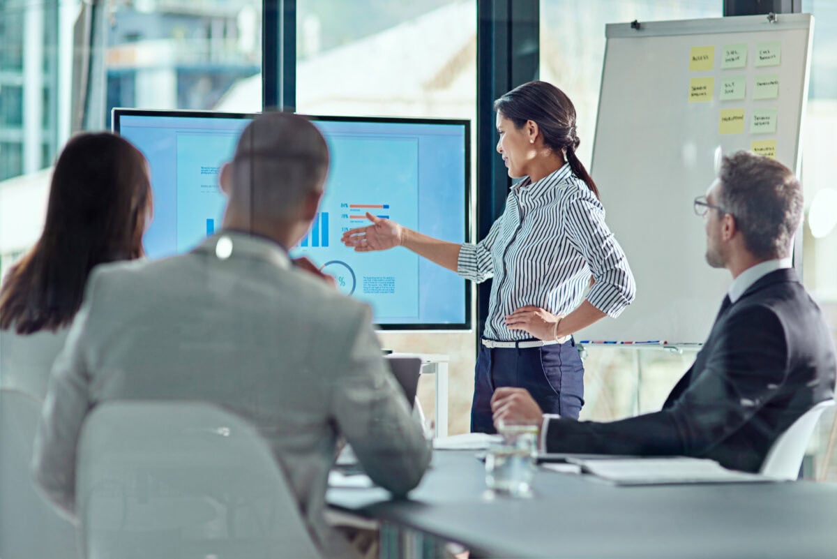 Beginning her presentation with a bang. a businesswoman delivering a presentation in the boardroom.