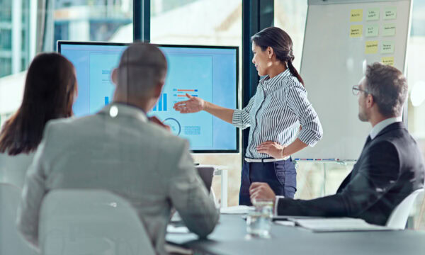 Beginning her presentation with a bang. a businesswoman delivering a presentation in the boardroom.