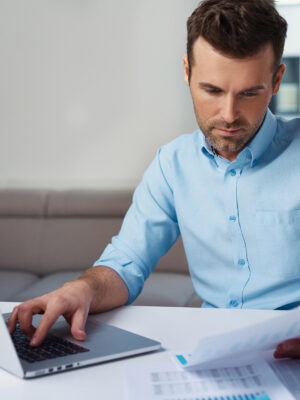 Young man paying bills